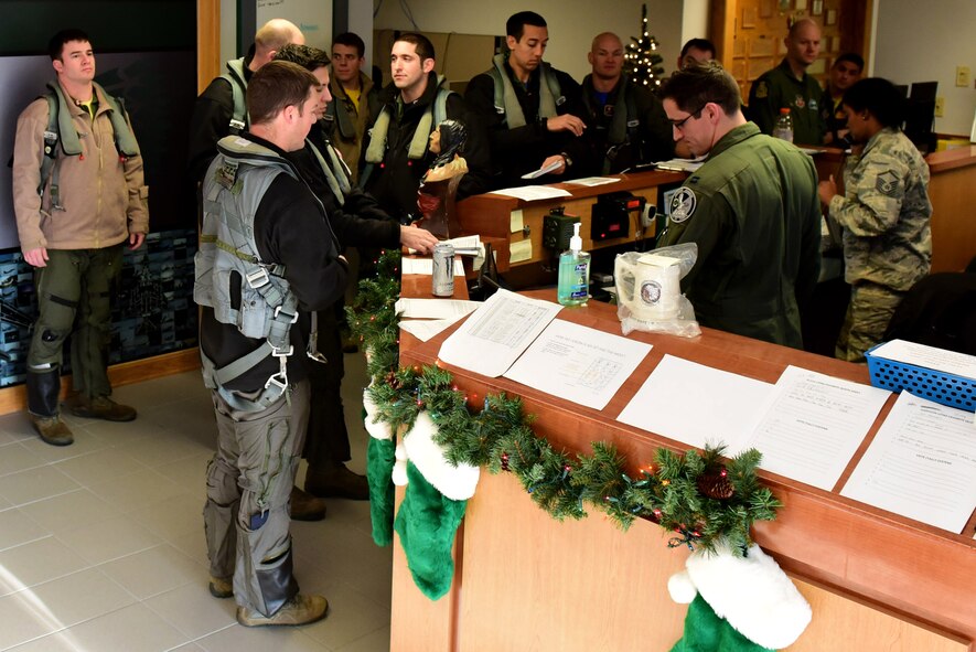 Members of the 335th Fighter Squadron prepare for a pre-flight brief during exercise Razor Talon Dec. 15, 2017, at Seymour Johnson Air Force Base, North Carolina.