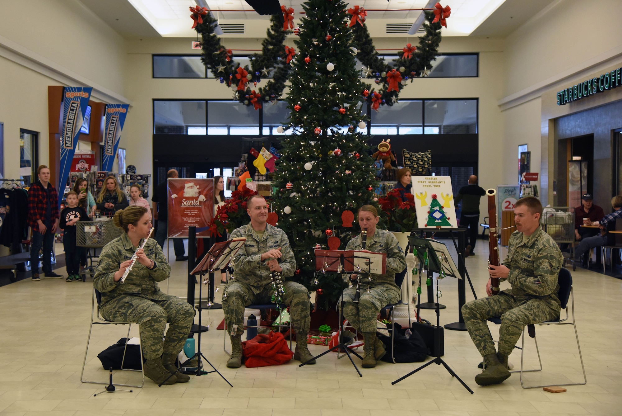 The U.S. Air Force Band of the West, Nightwatch, performs at the base exchange Dec. 14, on Keesler Air Force Base, Mississippi. During the two-day visit to Keesler the band performed for Airmen and local residents throughout various locations at Keesler and the nearby area. Their mission is to honor military heritage through music, connect with the American public and inspire patriotism and excellence. (U.S. Air Force photo by Kemberly Groue)