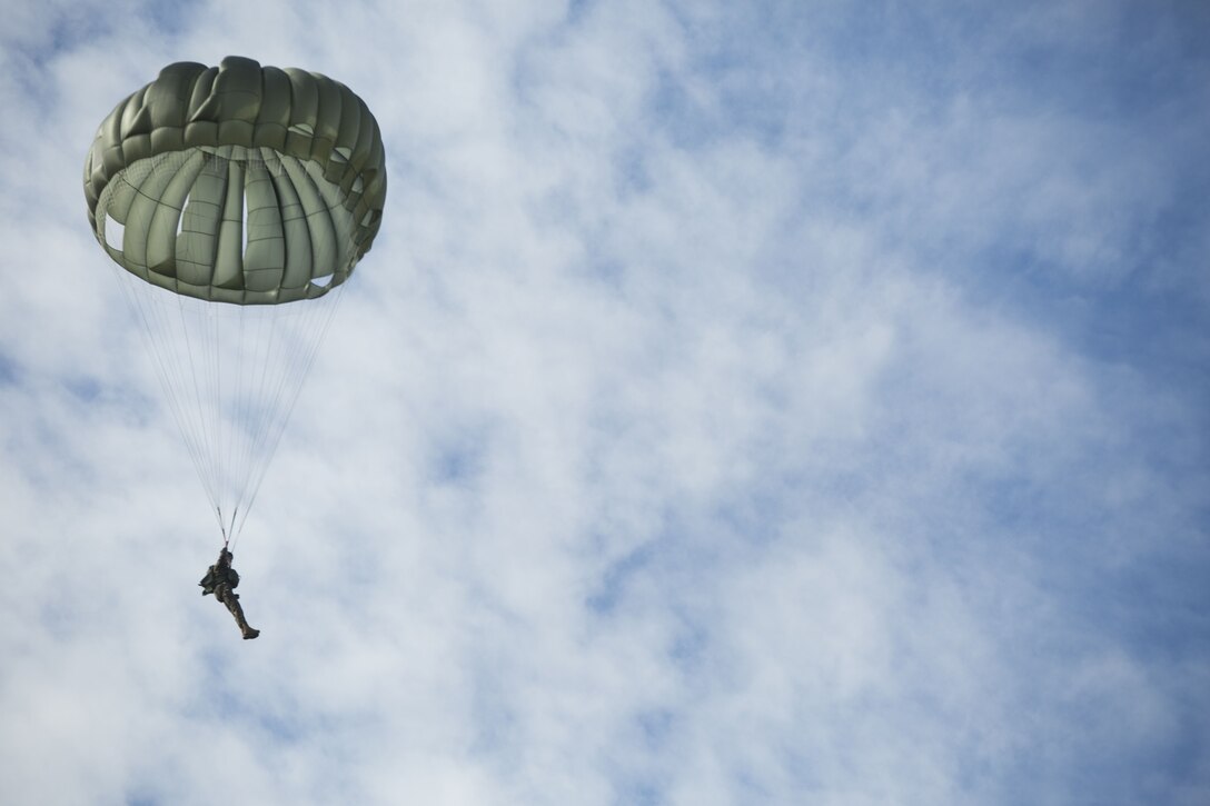 A Marine with 3rd Force Reconnaissance Company, 4th Marine Division, Marine Forces Reserve, performs a static line jump at Stennis Space Center in Hancock County, Mississippi, Dec. 14, 2017.