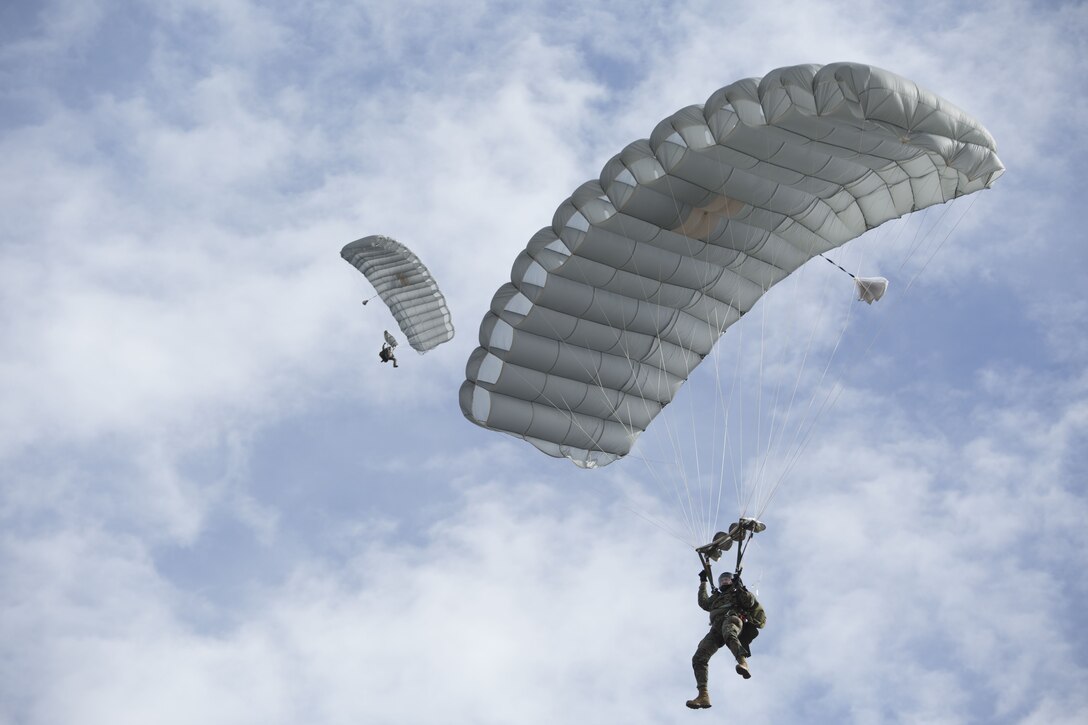 Marines with 3rd Force Reconnaissance Company, 4th Marine Division, Marine Forces Reserve, perform a free fall jump at Stennis Space Center in Hancock County, Mississippi, Dec. 14, 2017.