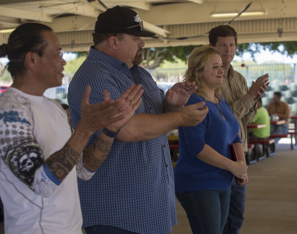 Members of the Civilian Employee Welfare Recreation Association celebrate the Marine Corps Air Station Yuma 2017 Employee of the Year at the MCAS Yuma, Ariz., Picnic Pavilion Oct. 26, 2017. This annual event is organized in appreciation of the civilian employees on the station. (U.S. Marine Corps photo by Lance Cpl. Sabrina Candiaflores)