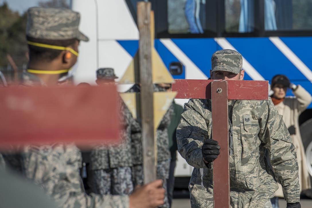 U.S. Air Force Staff Sgt. Jordan Premo, 374th Civil Engineer Squadron structures journeyman, maps out simulated damaged area during a rapid airfield damage repair demonstration, Dec. 12, 2017, at Yokota Air Base, Japan.