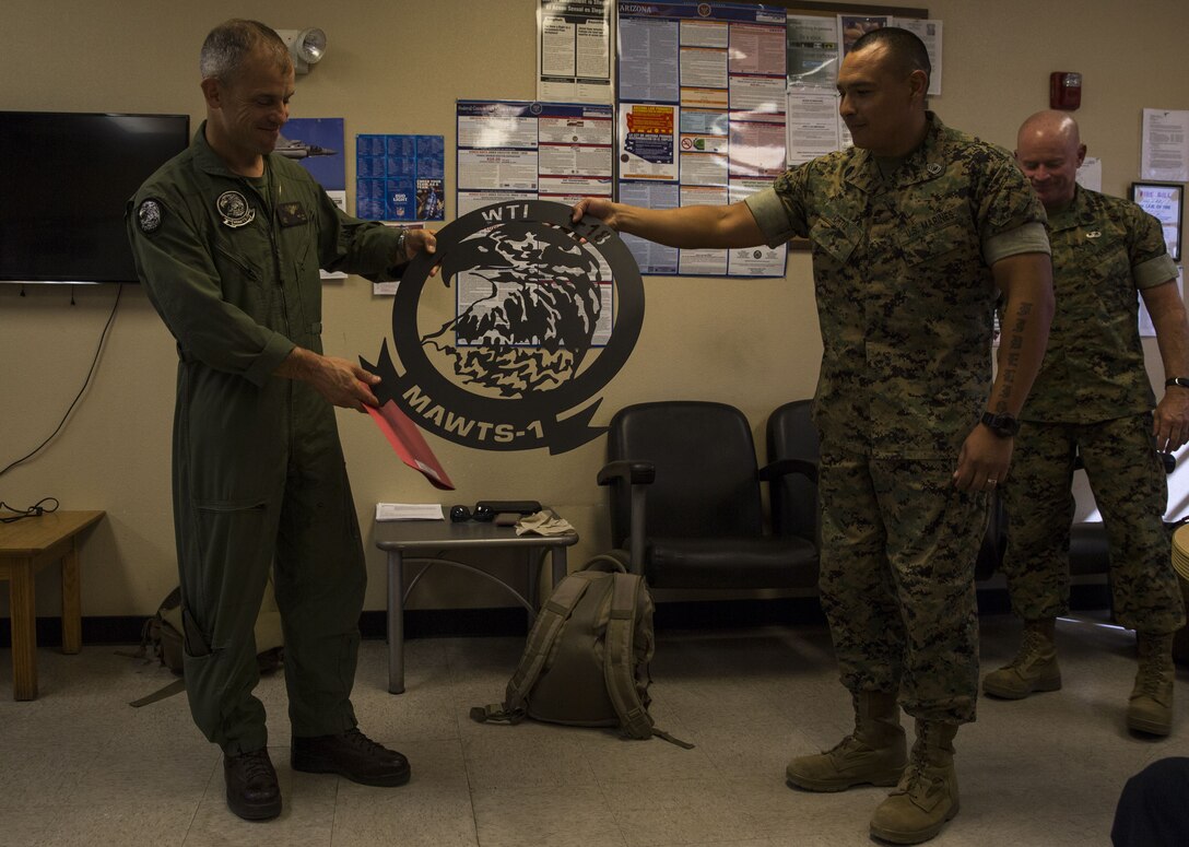 U.S. Marine Corps Col. James B. Wellons, the commanding officer of Marine Aviation Weapons and Tactics Squadron (MAWTS) One speaks to the Fuel Branch personnel at the Fuel Brance office on Marine Corps Air Station Yuma, Ariz., Oct. 26, 2017. The Fuel Branch supported MAWTS-1 in their efforts to provide standardized advanced tactical training during Weapons and Tactics Instructor courses twice a year in addition to daily routines and supporting other squadrons visiting or on station. (U.S. Marine Corps photo taken by Cpl. Christian Cachola)