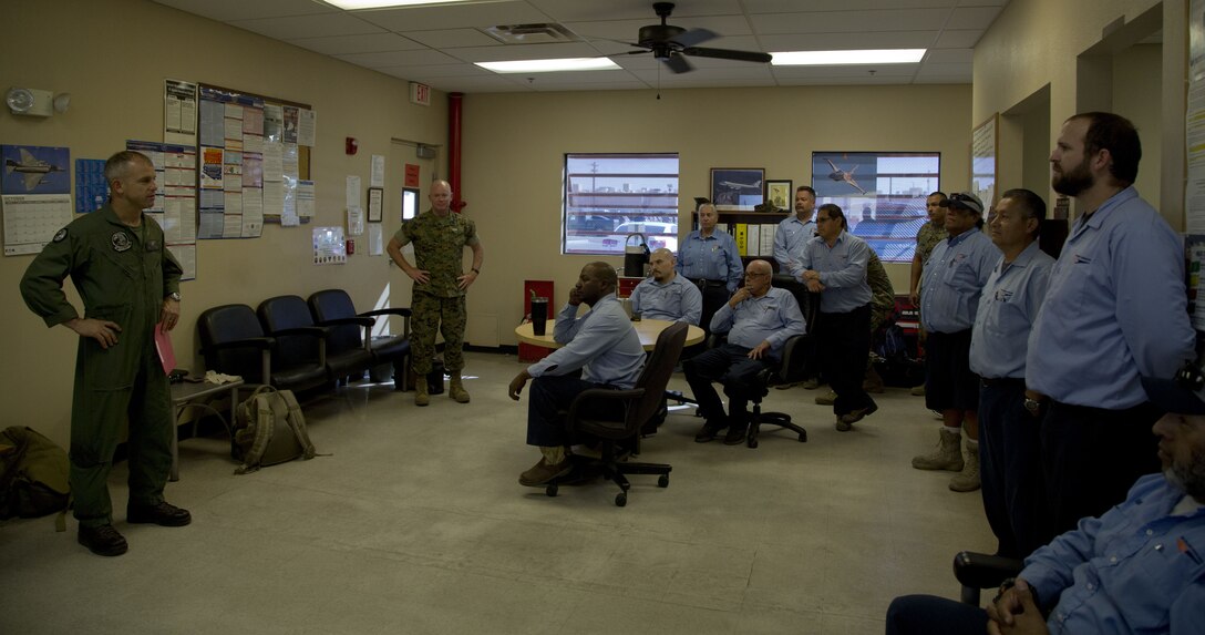 U.S. Marine Corps Col. James B. Wellons, the Commanding Officer of Marine Aviation Weapons and Tactics Squadron (MAWTS) One, and Sgt. Maj. Thomas W. Foster, the sergeant major of MAWTS-1, speak to the Fuel Branch personnel at the Fuel Branch office on Marine Corps Air Station Yuma, Ariz., Oct. 26, 2017. Station Fuel supported MAWTS-1 in their efforts to provide standardized advanced tactical training during Weapons and Tactics Instructor course twice a year in addition to their daily routines and supporting other squadrons visiting or on station. (U.S. Marine Corps photo taken by Lance Cpl. Hanna L. Powell)