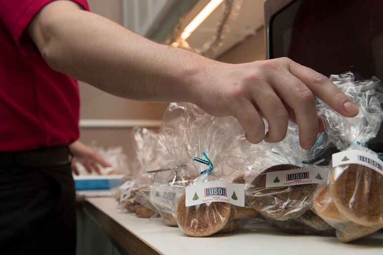 Nathan Evans, United Service Organizations Yokota field program manager, places labels onto freshly packaged cookies for the USO’s Cookie Caravan event, Dec. 14, 2017, Yokota Air Base, Japan.