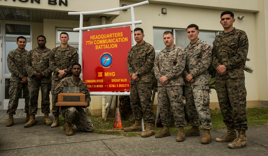 Marines with 7th Communication Battalion, III Marine Expeditionary Force Information Group, III MEF, brought home the Lloyd Memorial Trophy, Dec. 19, 2017, after the annual pacific division shooting matches held at Camp Hansen, Okinawa, Japan. It has been 40 years since the unit last won the trophy. Members of the team from left to right include: Cpl. Fernando Aguirre, Cpl. Melvon Davis, 1st Lt. Jeff Womelsdorf, Cpl. Mustafa Shabazz, 1st Lt. Nelson Lovos, Sgt. Nolan Peck, Sgt. Logan Maar, and Cpl. Alfredo Garciarodriguez. Gunnery Sgt. Justin Santiago, the only team member not depicted, was awarded a distinguished marksman badge. 1st Lt. Jeff Womelsdorf also achieved the top combined shooter during the event. (U.S. Marine Corps photo by Cpl. Jorge A. Rosales/released)