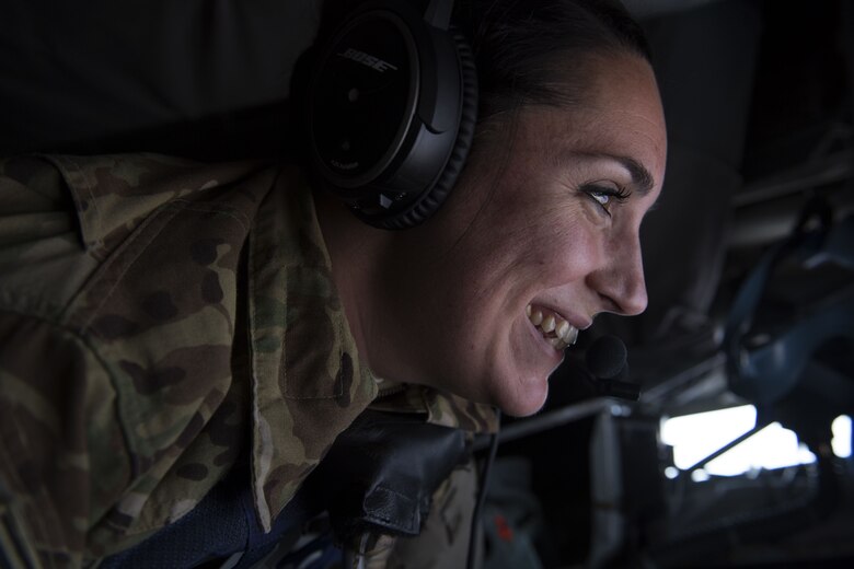 U.S. Air Force Staff Sgt. Rachel Cullen, a boom operator assigned to 447th Air Expeditionary Group, guides the boom of a KC-135 Stratotanker during a refueling mission over Syria, Dec. 1, 2017.