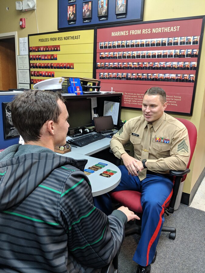 SAN ANTONIO, Texas -- Sergeant Jesse W. Swayze, a canvassing recruiter at Recruiting Substation Northeast, talks to an applicant about which challenge card he selected during their appointment.