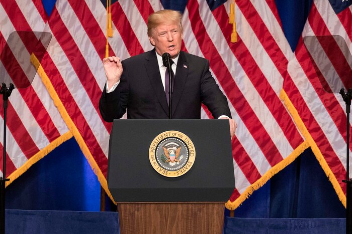 The president of the United States speaks from a podium.