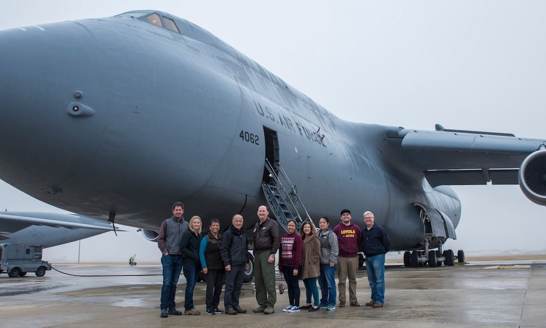 Col. Thomas Smith, 433rd Airlift Wing commander, met a group of distinguished visitors for a group photo on the flight line December 18, 2017 at Joint Base San Antonio-Lackland, Texas.