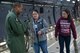 Master Sgt. Bryan Boyd, 356th Airlift Squadron load master, shows Kelly Kamiya and Karizza Cruz the different chains that are used to tie down cargo during a walk-through tour of a C-5M Super Galaxy aircraft December 18, 2017 at Joint Base San Antonio-Lackland, Texas.