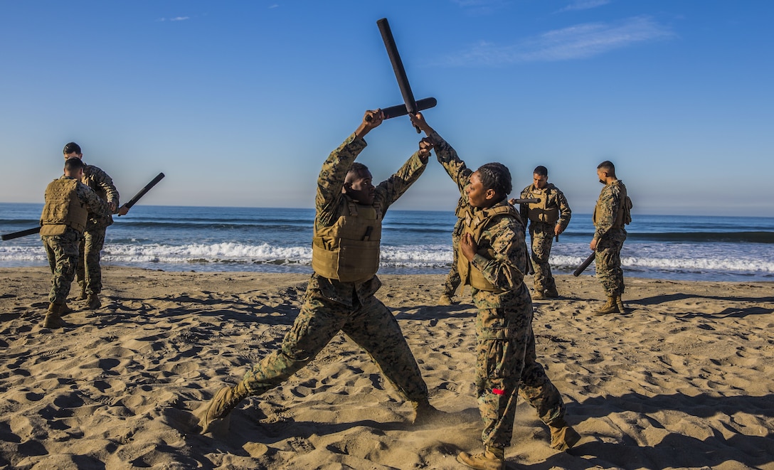 U.S Marines with Headquarters Regiment, 1st Marine Logistics Group, practice Marine Corps Martial Arts Program techniques during a field exercise at Camp Pendleton, Calif., Dec. 14, 2017. The Marines were participating in a Martial Arts Instructors course to earn their instructor tabs, allowing them to teach MCMAP to other Marines in the future.