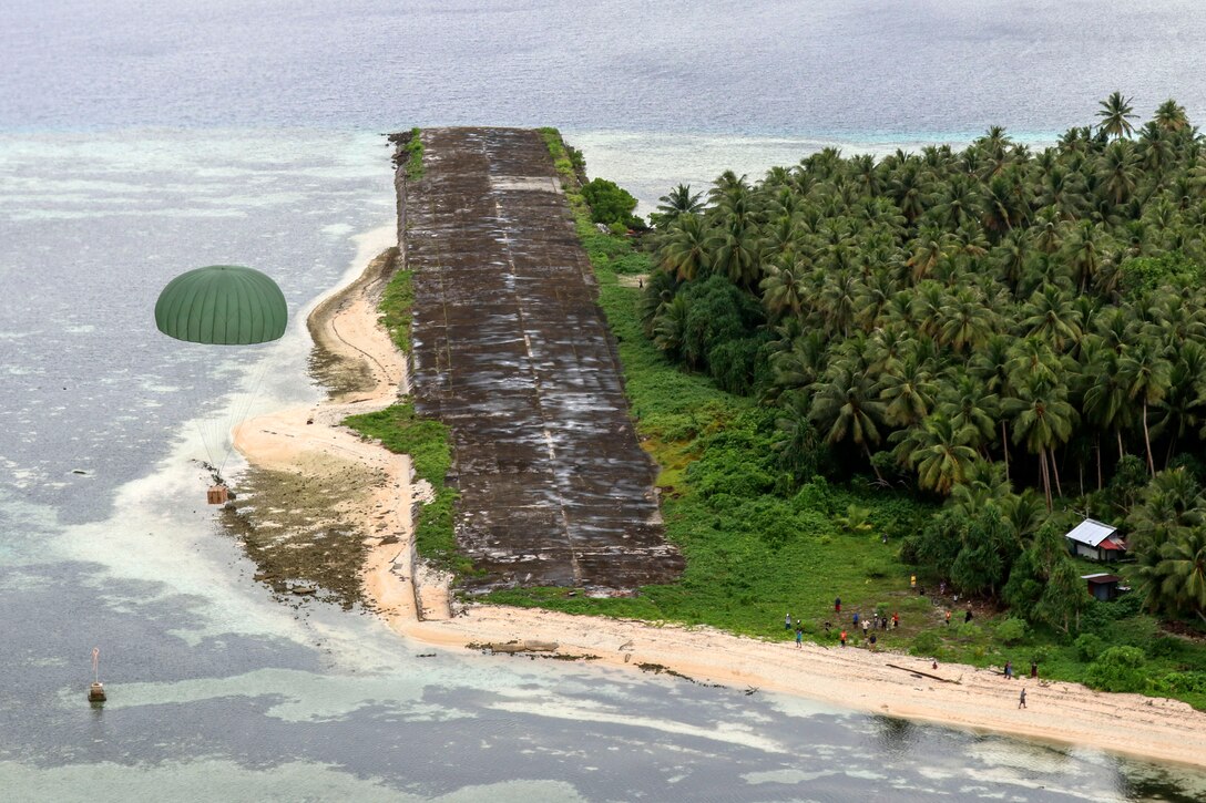 A bundle descends toward an island.