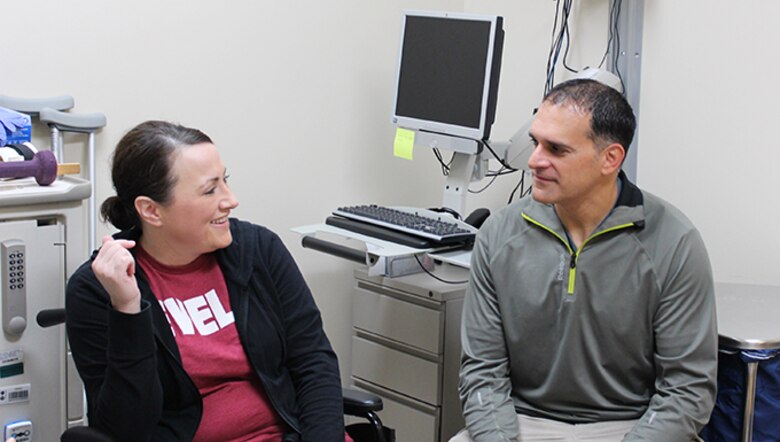 U.S. Air Force Maj. Stephanie Proellochs discusses her treatment journey with her husband, John at Walter Reed Medical Center, Nov. 8, 2017. Proellochs explains how her husband’s experience working with amputees prepared her for her own procedure. (U.S. Air Force photo by Karina Luis)