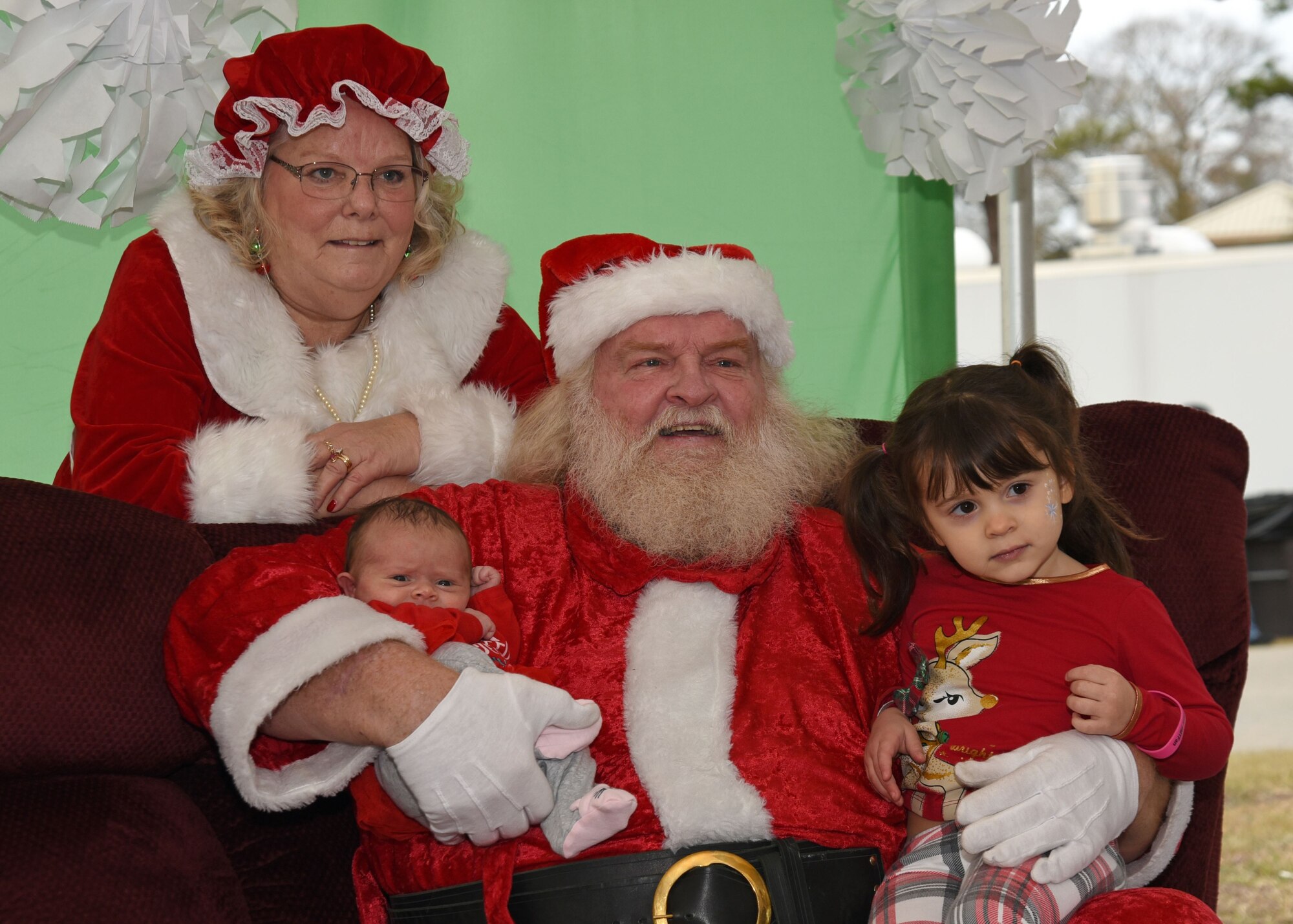Team Shaw children sit for a photo with Santa Claus and Mrs. Claus during Frosty Fest at Shaw Air Force Base, S.C., Dec. 17, 2017.