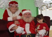 Team Shaw children sit for a photo with Santa Claus and Mrs. Claus during Frosty Fest at Shaw Air Force Base, S.C., Dec. 17, 2017.