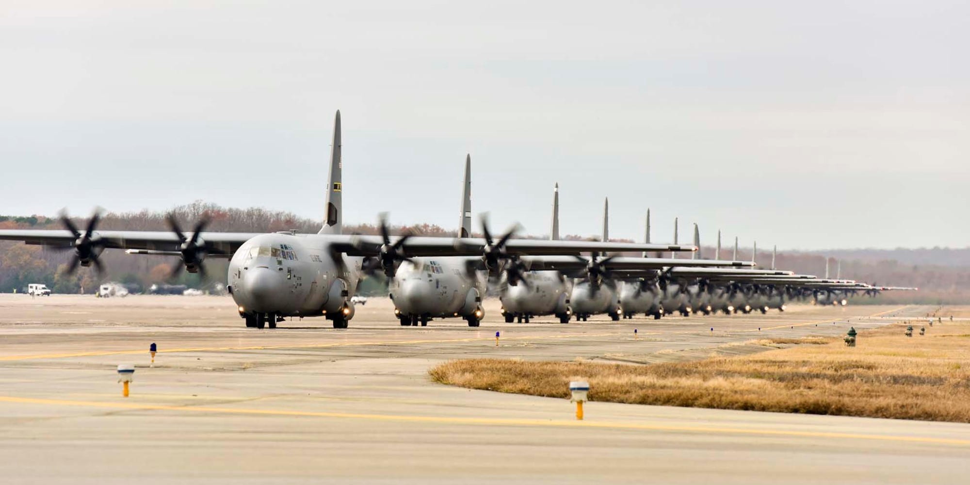 Fourteen C-130J aircraft perform an elephant walk towards the runway for takeoff during Operation Tenacious Turtle on Nov. 21, 2017, at Little Rock Air Force Base, Ark.