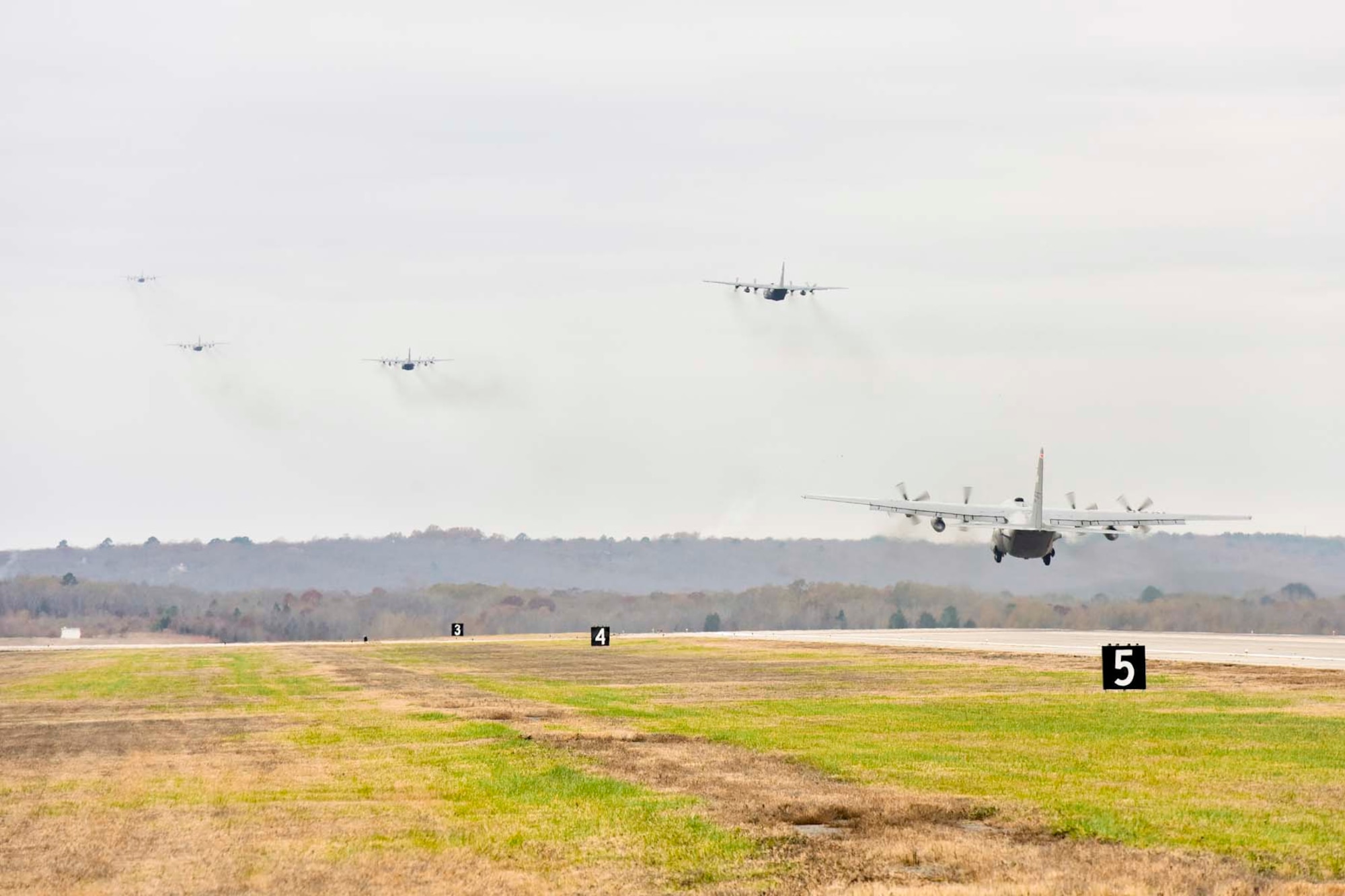 Five C-130J aircraft takeoff during Operation Tenacious Turtle as part of a 14-aircraft formation Nov. 21, 2017, at Little Rock Air Force Base, Ark.