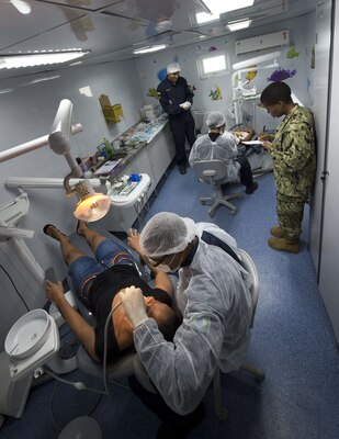 Doctors diagnose a patient near a remote village along the Amazon River.