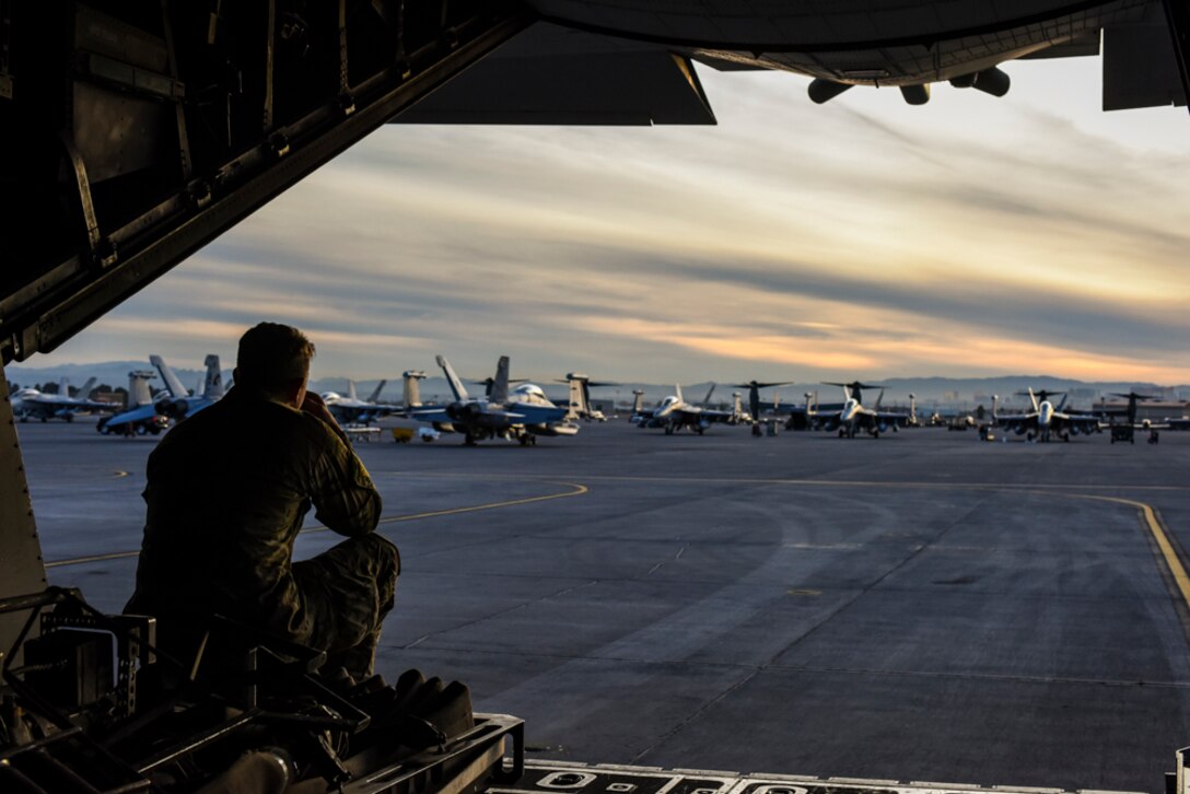 An Air Commando, assigned to the 1st Special Operations Logistic Readiness Squadron, Hurlburt Field, Florida, sits on the ramp of an MC-130H Combat Talon II, assigned to the 14th Weapons Squadron, prior to Coyote Freedom 401, Dec. 12, 2017, at Nellis AFB, Nevada. Coyote Freedom 401 is one of the USAF Weapons School’s advanced Special Operations exercise involving dozens of squadrons and aircraft from around the Air Force. (U.S. Air Force photo by Airman 1st Class Andrew D. Sarver/Released)