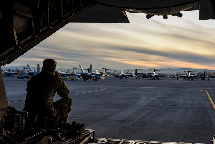 An Air Commando, assigned to the 1st Special Operations Logistic Readiness Squadron, Hurlburt Field, Florida, sits on the ramp of an MC-130H Combat Talon II, assigned to the 14th Weapons Squadron, prior to Coyote Freedom 401, Dec. 12, 2017, at Nellis AFB, Nevada. Coyote Freedom 401 is one of the USAF Weapons School’s advanced Special Operations exercise involving dozens of squadrons and aircraft from around the Air Force. (U.S. Air Force photo by Airman 1st Class Andrew D. Sarver/Released)