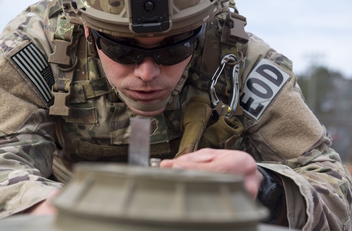 Staff Sgt. Sherwood D. Johnson IV, 628th Civil Engineer Squadron Explosive Ordnance Disposal technician takes measurements while performing a reconnaissance during the EOD Olympics Dec. 15, 2017.