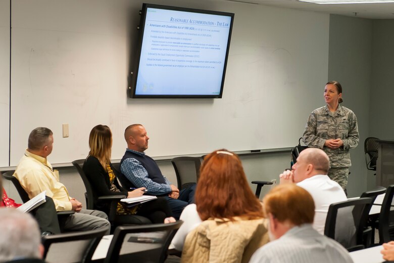 U.S. Air Force Maj. Susan Trepczynski, National Air and Space Intelligence Center staff judge advocate, discusses legal guidelines associated with reasonable accommodations during an open forum Nov. 28, 2017 at Wright-Patterson Air Force Base, Ohio. NASIC leaders held the forum for personnel to speak with different officials about working with people who have disabilities. . (U.S. Air Force photo by Senior Airman Michael Hunsaker/Released)