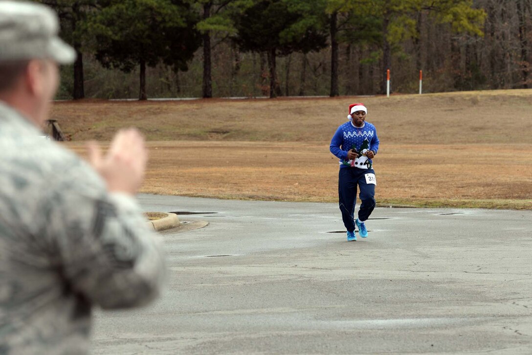 U.S. Air Force Reserve Staff Sgt. Corey Malone, a maintenance management production technician assigned to the 913th Maintenance Squadron, finishes the Chief’s 5K Fall Fun Run at Little Rock Air Force Base, Ark., Dec. 18, 2017.