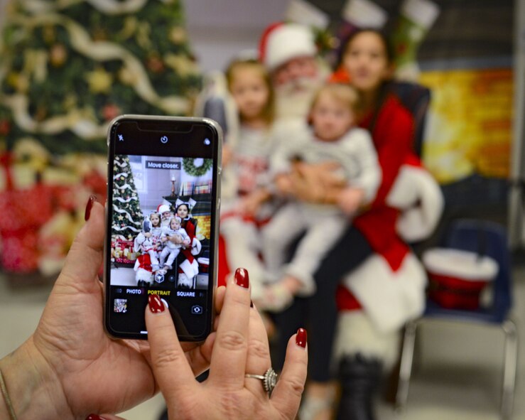 A child makes a craft during a holiday party, Dec. 15, 2017, at Moody Air Force Base, Ga. The Airman and Family Readiness Center hosted the event for families of deployed or remote-tour Airmen, and families enrolled in the Exceptional Family Member Program. During the party, families enjoyed a turkey dinner, played games, made arts and crafts for their loved ones and shared a special moment with Santa Claus. (U.S. Air Force photo by Senior Airman Lauren M. Sprunk)