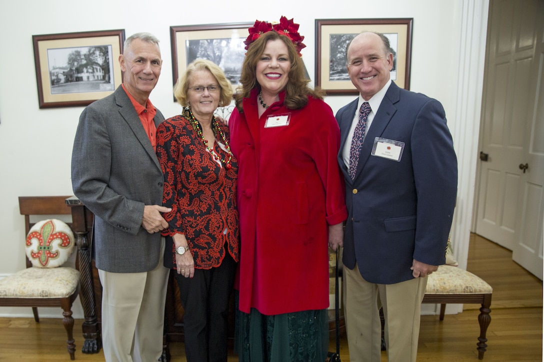 (From left to right) Lt. Gen. Rex C. McMillian, commander of Marine Forces Reserve and Marine Forces North, Becky McMillian, Kathy Callahan and retired Rear Adm. Dave Callahan pose for a picture at McMillian’s annual Christmas party, Dec. 16, 2017.