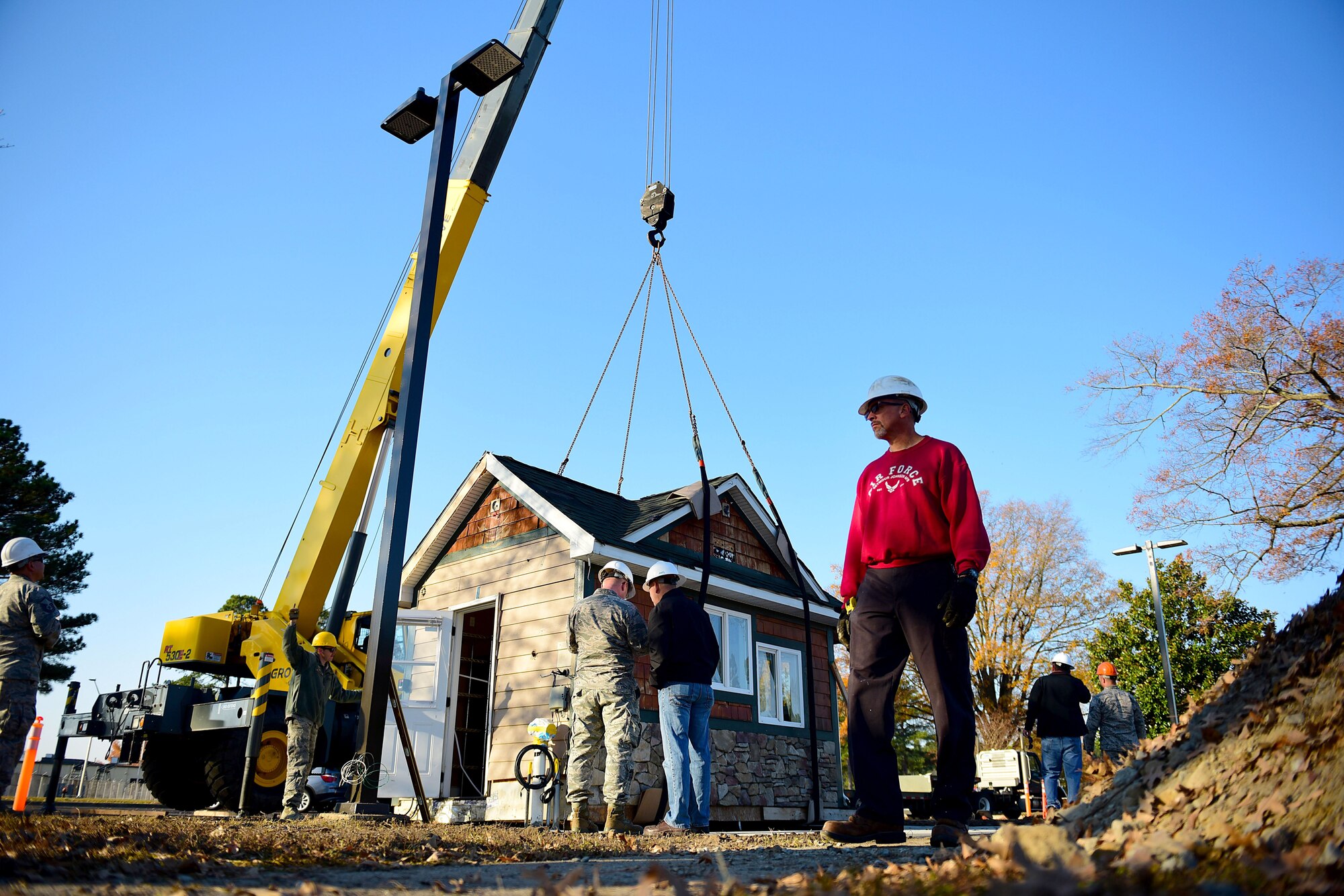 Members from Team Seymour place a building to be used for the new Seymo Joe to Go coffee kiosk, Dec. 1, 2017, at Seymour Johnson Air Force Base, North Carolina. The shop has a drive-thru and walk-up window to serve customers. (U.S. Air Force photo by Airman 1st Class Kenneth Boyton)