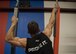 Tech. Sgt. David Krause, 58th Maintenance Squadron CV-22 “osprey” crew chief, works on grips strength using floating boards at the Ninja Force Gym, Albuquerque, N.M., Dec. 4. Krause placed second in the Ultimate Ninja Athlete Association qualifier adult competition with a course time of 5:45.