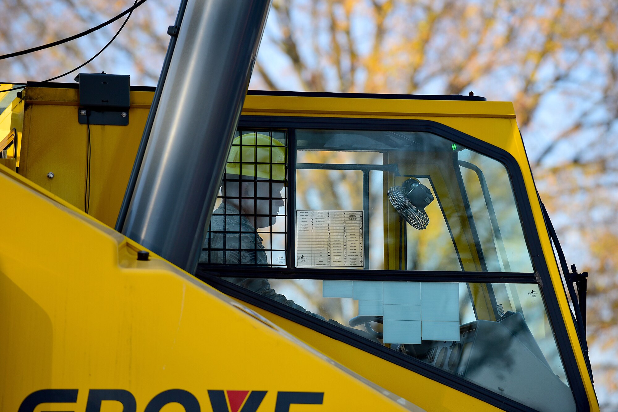 Staff Sgt. Jonathan Russell, 4th Civil Engineer Squadron pavements and equipment technician, operates a crane while placing the new Seymo Joe to Go coffee kiosk, Dec. 1, 2017, at Seymour Johnson Air Force Base, North Carolina. The shop will serve locally roasted coffee, bagels, cream cheese, protein packs, and other items. (U.S. Air Force photo by Airman 1st Class Kenneth Boyton)