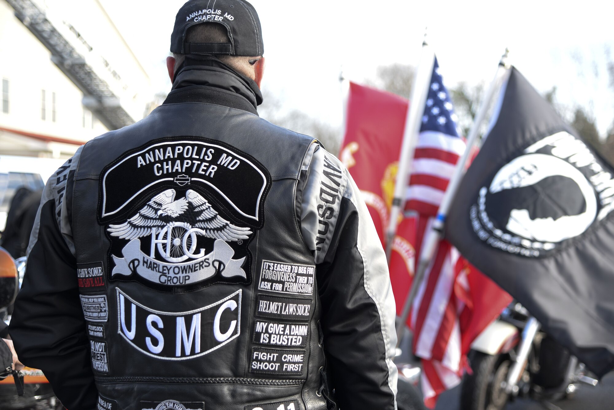 A marine veteran from Annapolis, Md., stands in front of his tricycle Dec. 14, 2017, outside the Camden-Wyoming Fire Company in Camden-Wyoming, Del. Motorcyclists lead the Wreaths Across America convoy from Harrington, Maine, to Arlington National Cemetery, Va., where the wreaths would be laid on the graves of fallen service members. (U.S. Air Force photo by Staff Sgt. Aaron J. Jenne)