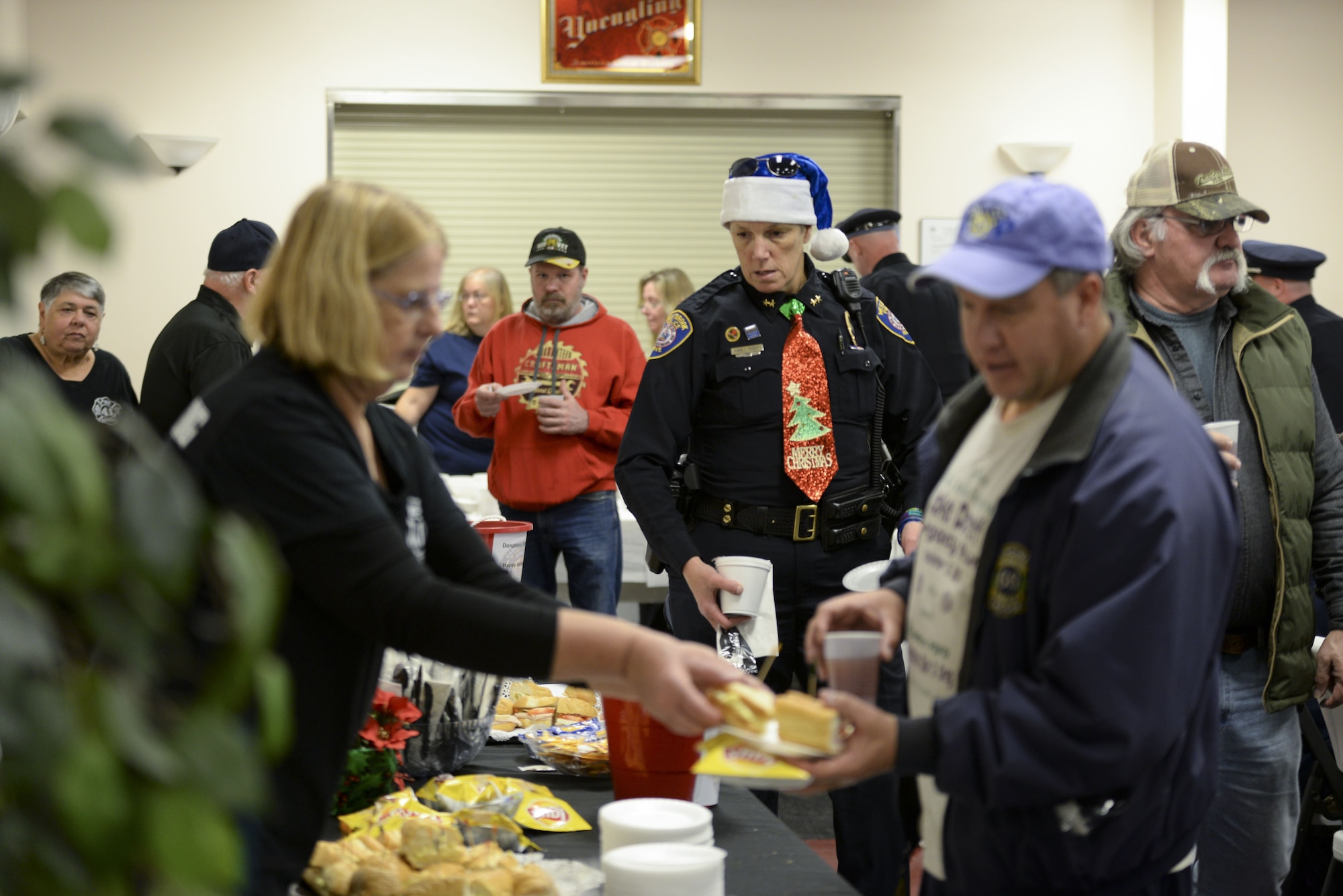 Members of the Camden-Wyoming Fire Company Auxiliary serve food to local veterans, law enforcement officers and first responders Dec. 14, 2017, at the Camden-Wyoming Fire Company in Camden-Wyoming, Del. More than 150 people attended the Wreaths Across America Stop Ceremony, which honored veterans and their families. (U.S. Air Force photo by Staff Sgt. Aaron J. Jenne)