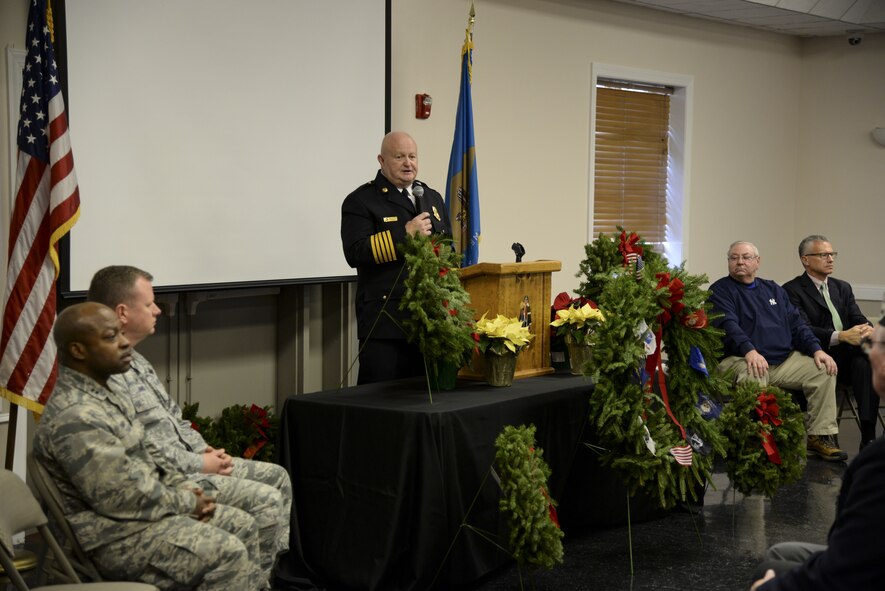 James Queen Sr., Camden-Wyoming Fire Company president, thanks attendees for supporting the Wreaths Across America mission Dec. 14, 2017, at the Camden-Wyoming Fire Company in Camden-Wyoming, Del. Queen was joined by guest speakers Justin King, mayor of Camden, Frankie Dale Rife, mayor of Wyoming, Morrill Worchester, owner of the Worchester Wreath Company and founder of Wreaths Across America, and Col. Robert Nance, 436th Operations Group commander. (U.S. Air Force photo by Staff Sgt. Aaron J. Jenne)