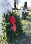 Remembrance wreaths adorn the gravesites of fallen service members Dec. 16, 2017, at Arlington National Cemetery in Arlington, Va. Tens of thousands of volunteers placed the wreaths during National Wreaths Across America Day. (U.S. Air Force photo by 2nd Lt. Natasha O. Mosquera)