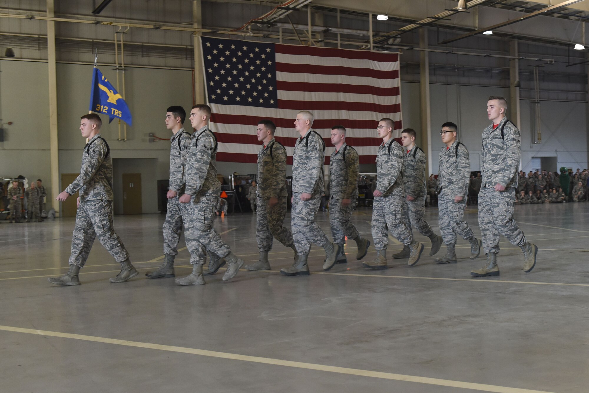 The 312th Training Squadron drill team performs their routine during the regulation drill segment during the 17th Training Group drill competition at the Louis F. Garland Department of Defense Fire Academy on Goodfellow Air Force Base, Texas, Dec. 15, 2017. The regulation drill segment was the first of the three judged events in the drill competition. (U.S. Air Force Photo by Airman 1st Class Zachary Chapman/Released)