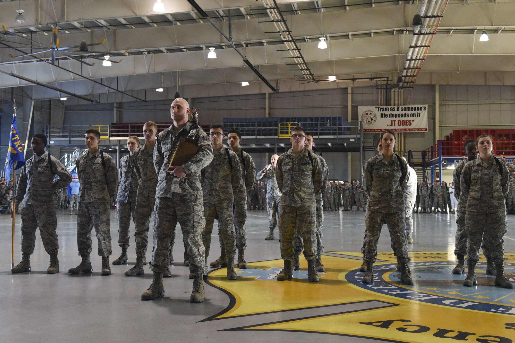 The 316th Training Squadron drill team poses with the trophy moments after winning the 17th Training Group drill competition at the Louis F. Garland Department of Defense Fire Academy on Goodfellow Air Force Base, Texas, Dec. 15, 2017. The 316th TRS won all three categories of the competition. (U.S. Air Force Photo by Airman 1st Class Zachary Chapman/Released)