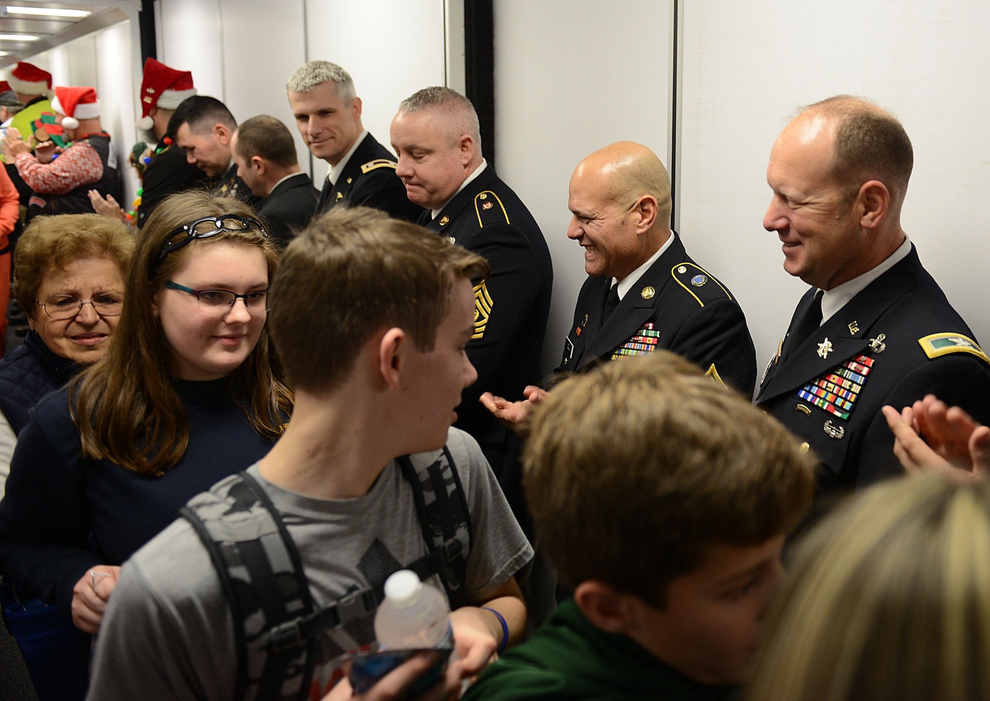 Joint Base Langley-Eustis, Va., senior leaders cheer for Gold Star families as they board the Snowball Express at Norfolk International Airport, Va., Dec. 9, 2017.