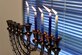 The Menorah after five of the eight candles are lit for the ceremony on Goodfellow Air Force Base, Dec. 15, 2017. Throughout the eight days of Hanukkah the lights are considered sacred and only to be looked at as an offer in thanks and praise. (U.S. Air Force photo by Airman 1st Class Seraiah Hines/Released)
