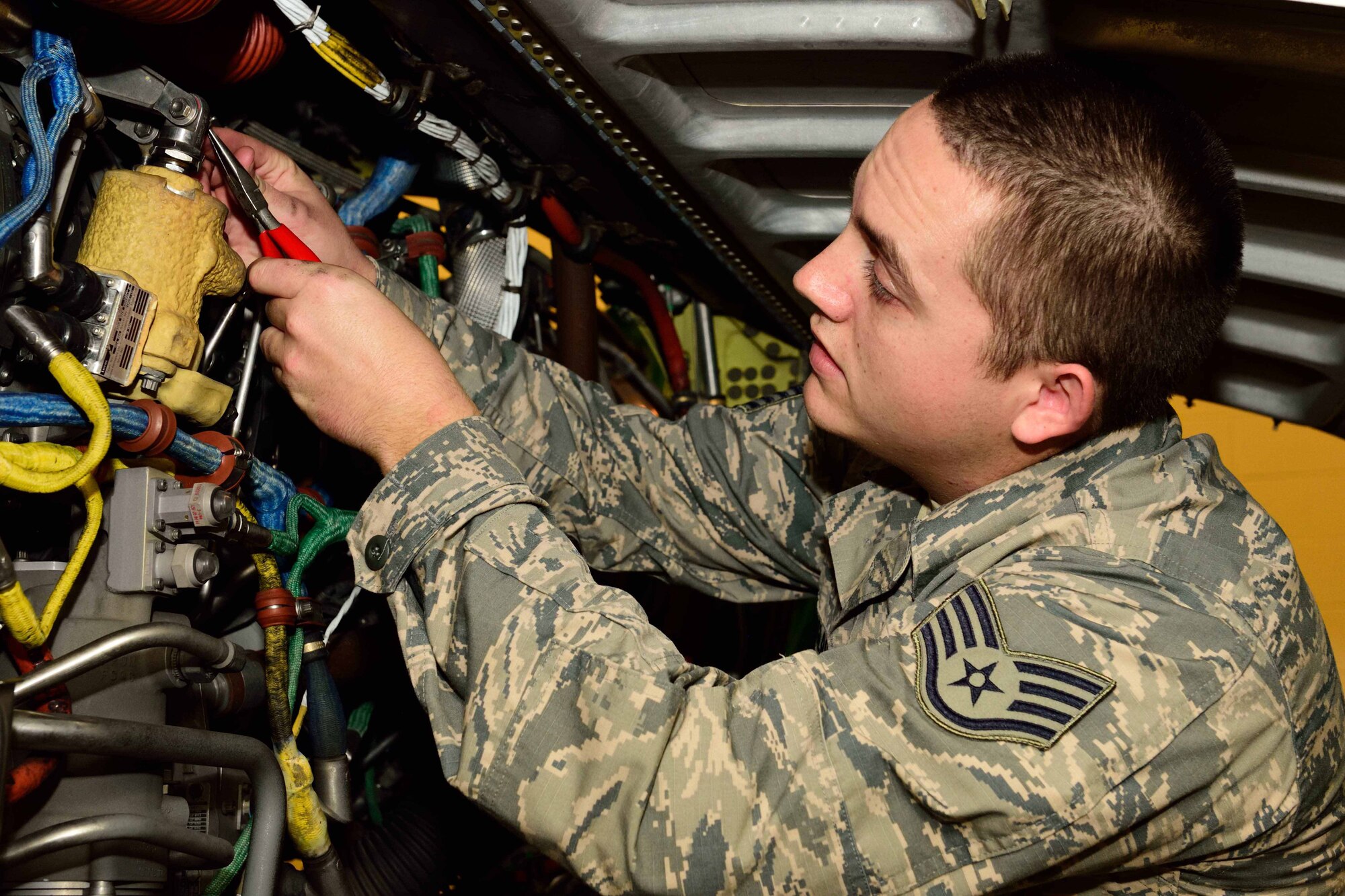 Staff Sgt. John Douglas, 403rd Aircraft Maintenance Squadron propulsion technician, reinstalls a compressor variable guide vane actuator, which controls air flow to the engine of a WC-130J Super Hercules aircraft, at Keesler Air Force Base, Mississippi, Dec. 19, 2017. The 403rd AMXS maintains the aircraft flown by the 53rd Weather Reconnaissance Squadron “Hurricane Hunters” here. (U.S. Air Force photo by Tech. Sgt. Ryan Labadens)