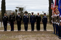 Commanders, active duty service members and the Goodfellow Color Guard stand at attention during the Wreaths Across America ceremony at Belvedere Memorial Park, San Angelo, Texas, Dec. 16, 2017. A representative from each branch laid a wreath for those who gave the ultimate sacrifice while serving. (U.S. Air Force photo by Airman 1st Class Seraiah Hines/Released)