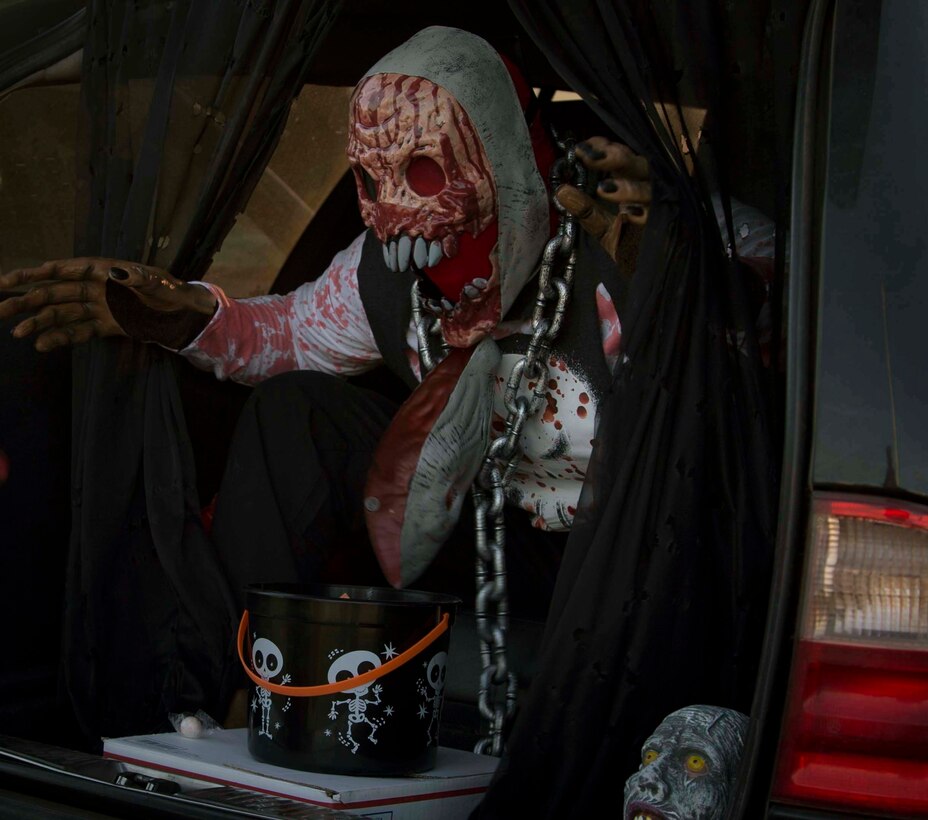 Active duty military members, DoD personnel and their families enjoy candy, games, and Halloween decorations during the third annual Trunk or Treat event held on the parade deck aboard Marine Corps Air Station Yuma, Ariz., Oct. 26, 2017. The event is a collaborative effort between the Alcohol Abuse Prevention Program, the Sexual Assault Prevention Program, the Drug Demand Reduction Program, and Marine Corps Family Team Building in honor of Red Ribbon Week. (U.S. Marine Corps photo by Lance Cpl. Joel Soriano)
