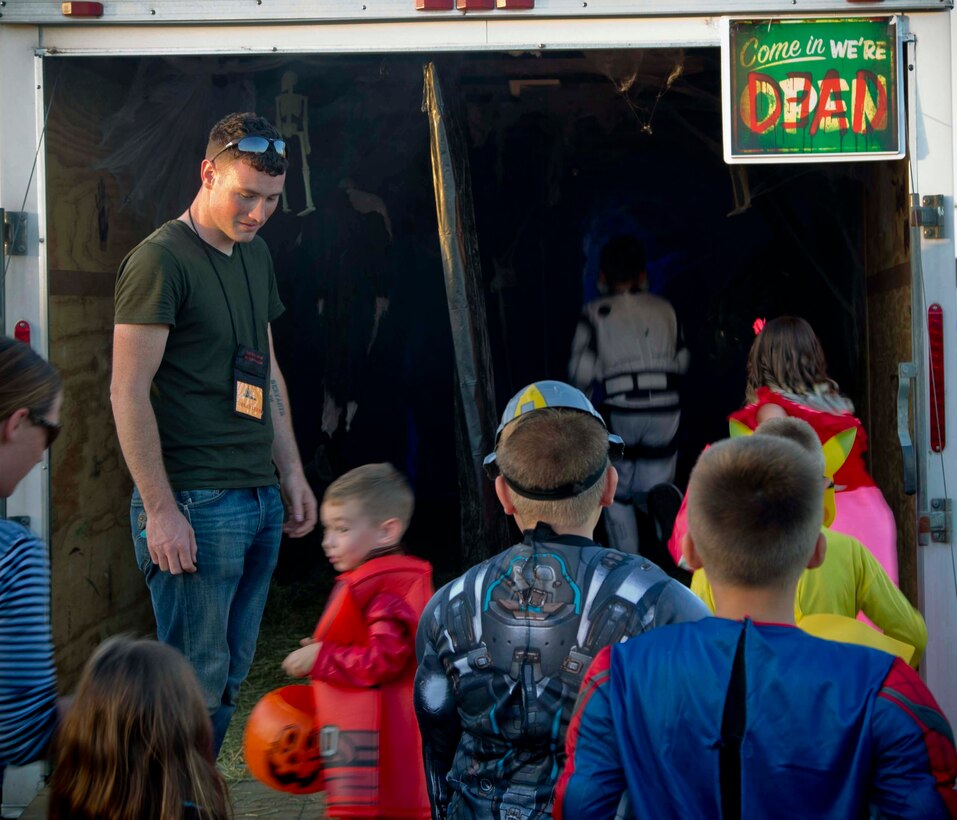 Active duty military members, DoD personnel and their families enjoy candy, games, and Halloween decorations during the third annual Trunk or Treat event held on the parade deck aboard Marine Corps Air Station Yuma, Ariz., Oct. 26, 2017. The event is a collaborative effort between the Alcohol Abuse Prevention Program, the Sexual Assault Prevention Program, the Drug Demand Reduction Program, and Marine Corps Family Team Building in honor of Red Ribbon Week. (U.S. Marine Corps photo by Lance Cpl. Joel Soriano)