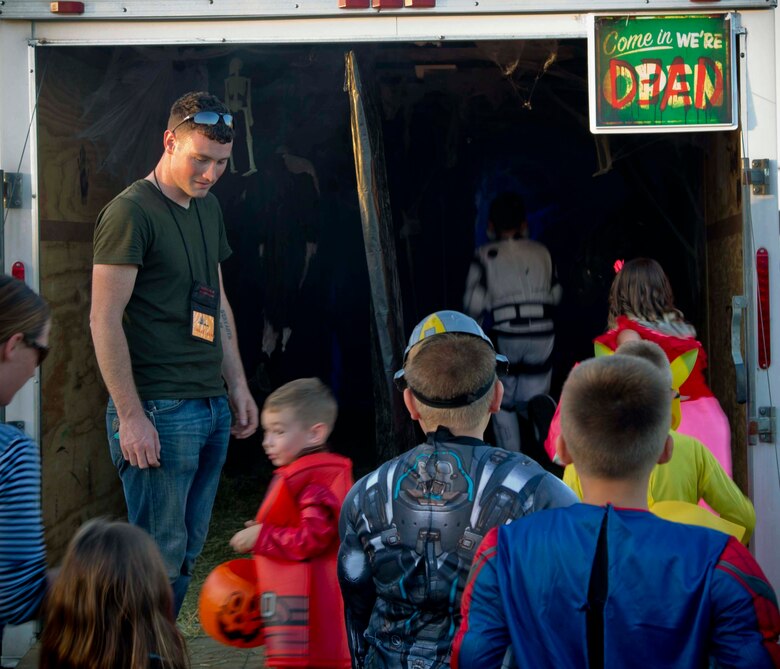 Active duty military members, DoD personnel and their families enjoy candy, games, and Halloween decorations during the third annual Trunk or Treat event held on the parade deck aboard Marine Corps Air Station Yuma, Ariz., Oct. 26, 2017. The event is a collaborative effort between the Alcohol Abuse Prevention Program, the Sexual Assault Prevention Program, the Drug Demand Reduction Program, and Marine Corps Family Team Building in honor of Red Ribbon Week. (U.S. Marine Corps photo by Lance Cpl. Joel Soriano)