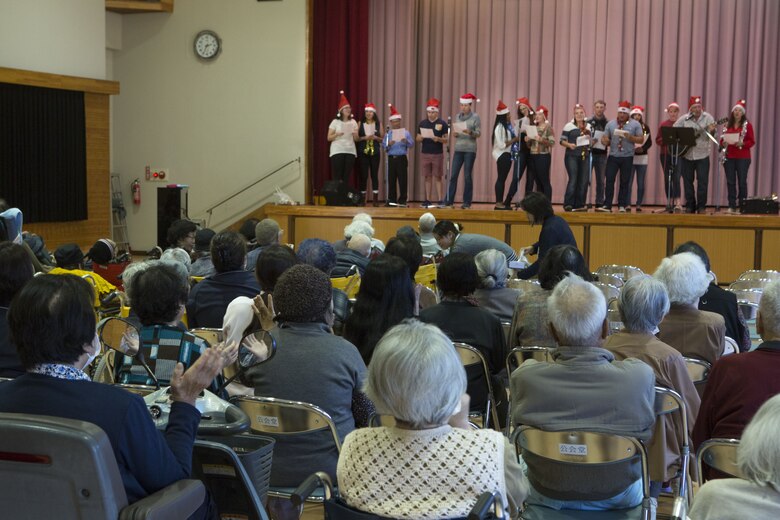 NAGO, OKINAWA, Japan— Service members sing Christmas carols to a group of elderly residents Dec. 15 at the Okinawa Airakuen Sanatorium in Nago, Okinawa, Japan.