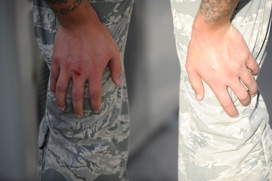 A 380th Expeditionary Security Forces member steps outside for fresh air after the "Redman" portion of ASP Baton training at Al Dhafra Air Base, United Arab Emirates Dec. 1, 2017. Security Forces members are responsible for the safety, personnel and assets on the installation. 
 (U.S. Air Force photo by Tech. Sgt. Anthony Nelson Jr)