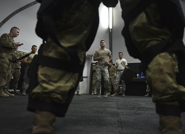 Senior Airman Ethan Floyd, 380th Expeditionary Security Forces, performs a one minute round of physical exercise before the "Redman" portion of ASP Baton training at Al Dhafra Air Base, United Arab Emirates Dec. 1, 2017. The physical exercise before entering the redman is to increase the heart rate and simulate the mental and physical changes that occur before an incident.  (U.S. Air Force photo by Tech. Sgt. Anthony Nelson Jr)