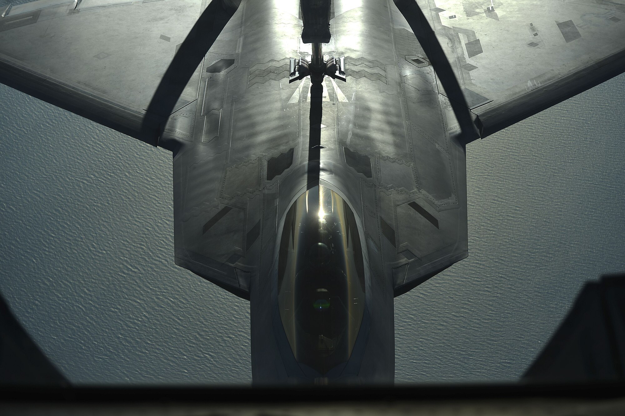 An F-22 assigned to the 380th Air Expeditionary Wing, Al Dhafra Air Base, United Arab Emirates receives fuel over the Arabian Peninsula from a KC-10 Extender, Nov. 29, 2017. The F-22 is a component of the Global Strike Task Force, supporting U.S. and Coalition forces working to liberate territory and people under the control of ISIS. 

 (U.S. Air Force photo by Tech. Sgt. Anthony Nelson Jr.)